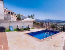 swimming pool, sky, outdoor, ground, palm tree, house, resort, swimming, water, beach